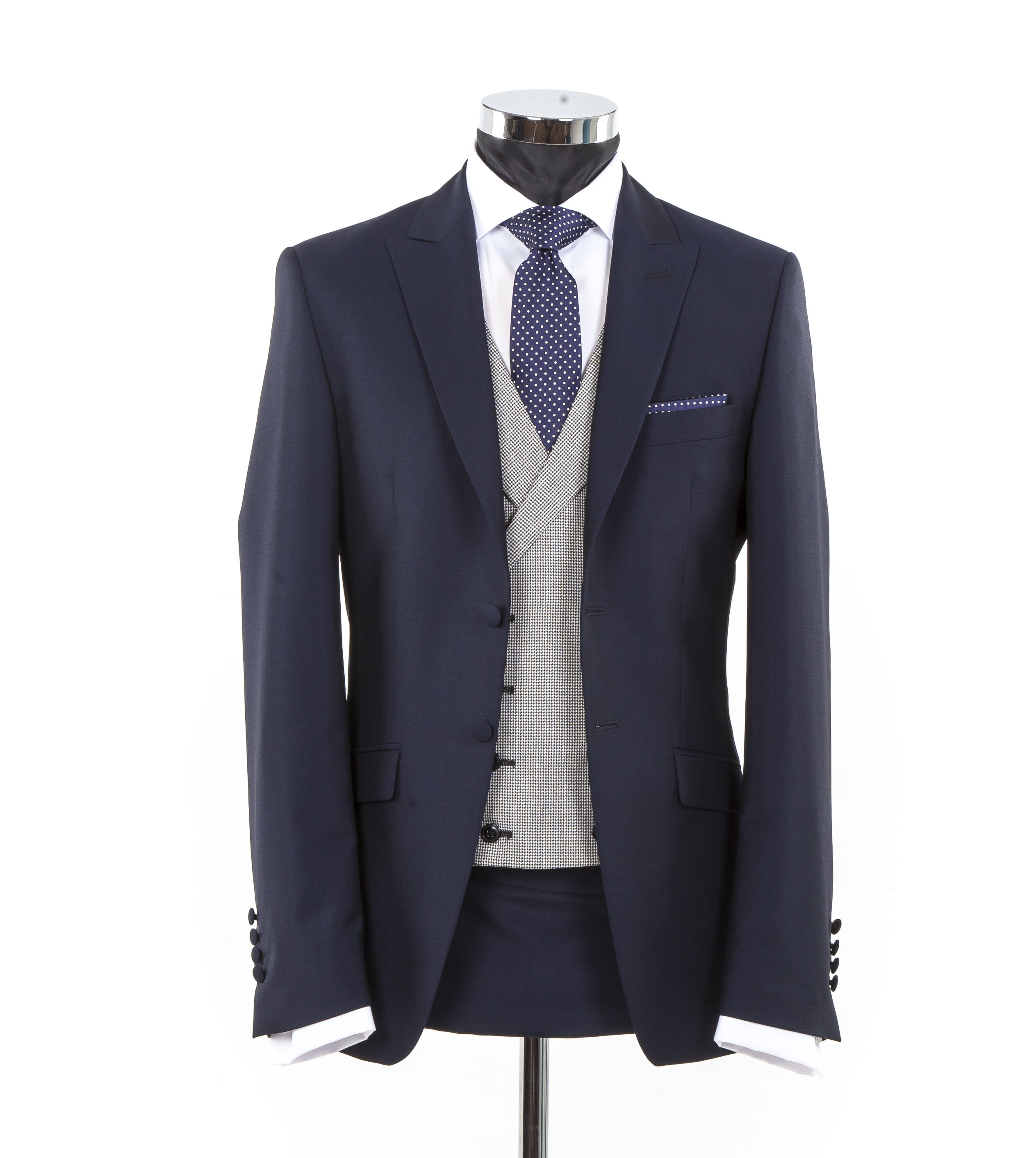 Slim Fitting Wedding Suit for Hire in 2025. Navy blue wedding suit with great waistcoat and navy silk polka dot tie.